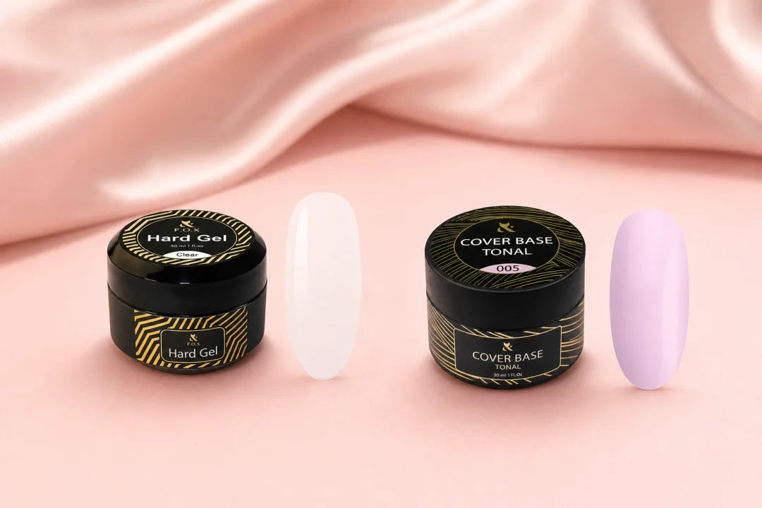 Żel czy hybryda — F.O.X Hard Gel Clear i F.O.X Cover Base Tonal 005 obok siebie na różowym jedwabnym tle